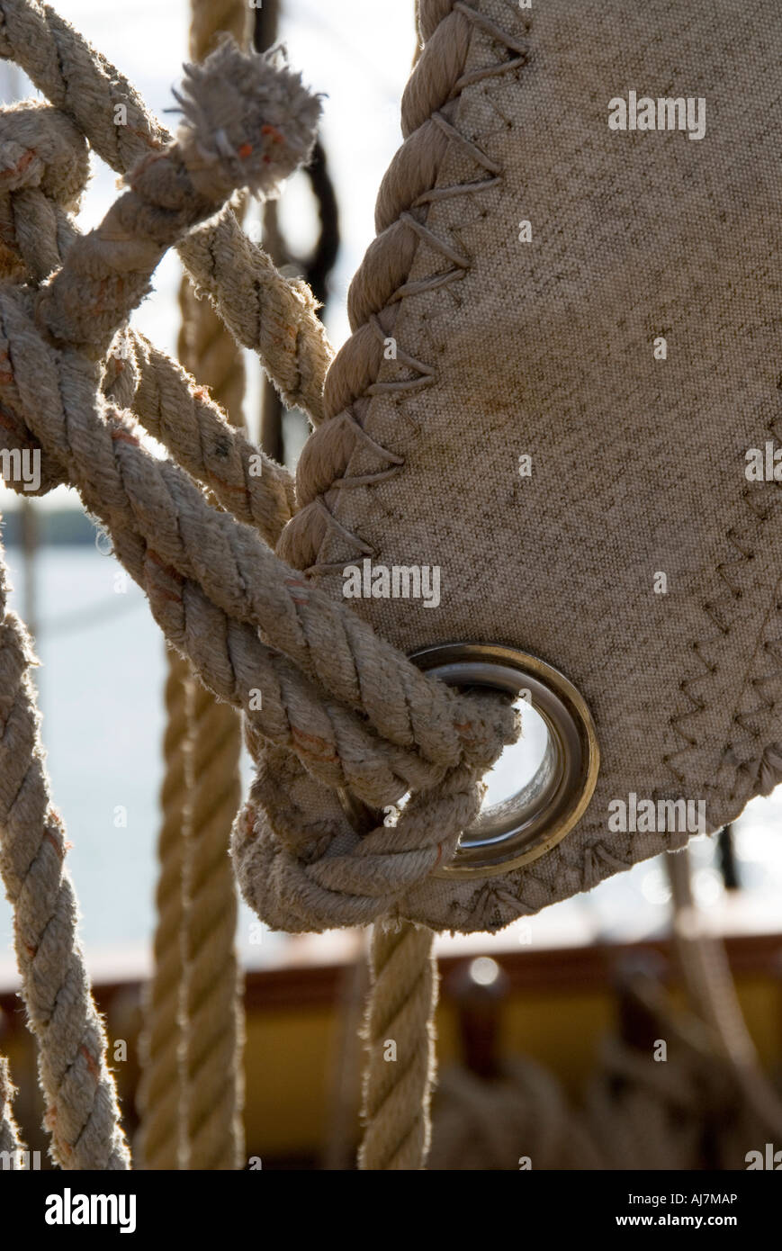 canvas sail lashing on board the reproduction sailing vessel HMS Bounty Stock Photo