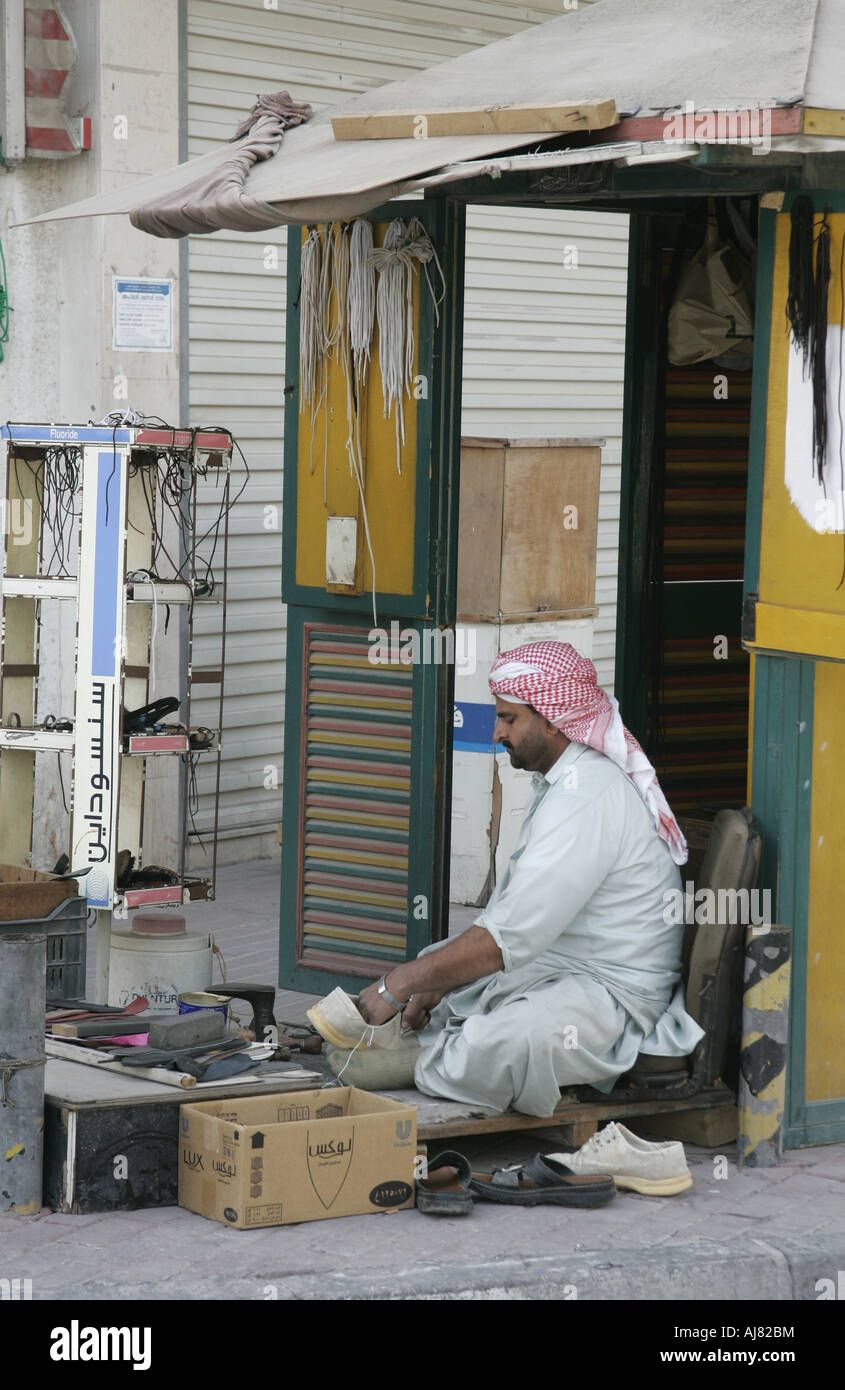 Shoe repairs on the pavement in Doha,Qatar Stock Photo Alamy