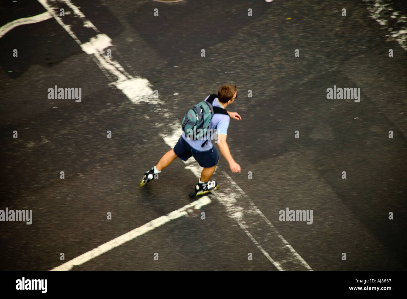 Overhead view of Man on roller skates on Eighth Avenue in Midtown