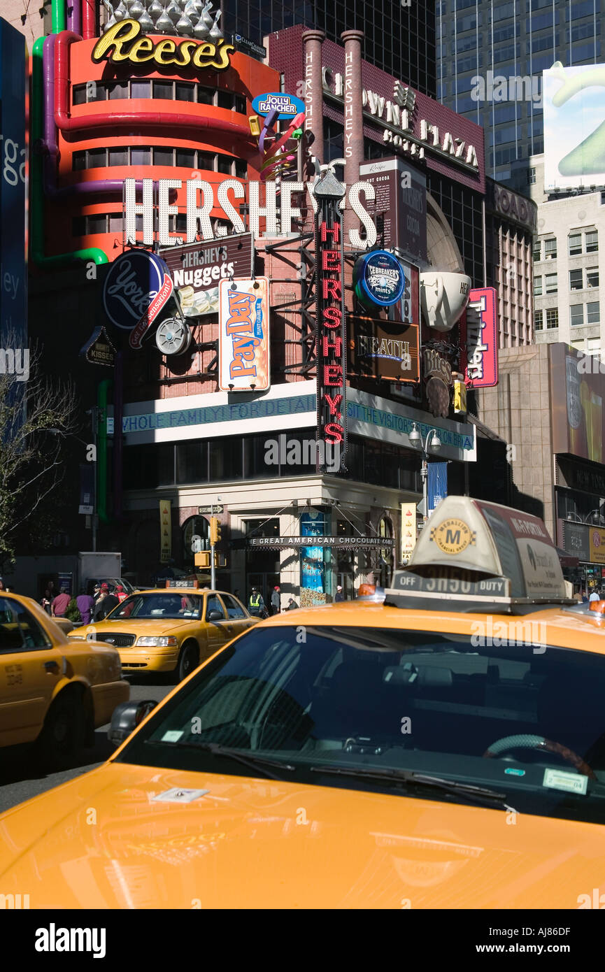 Hershey Chocolate store on Broadway in Times Square with taxis New York NY Stock Photo