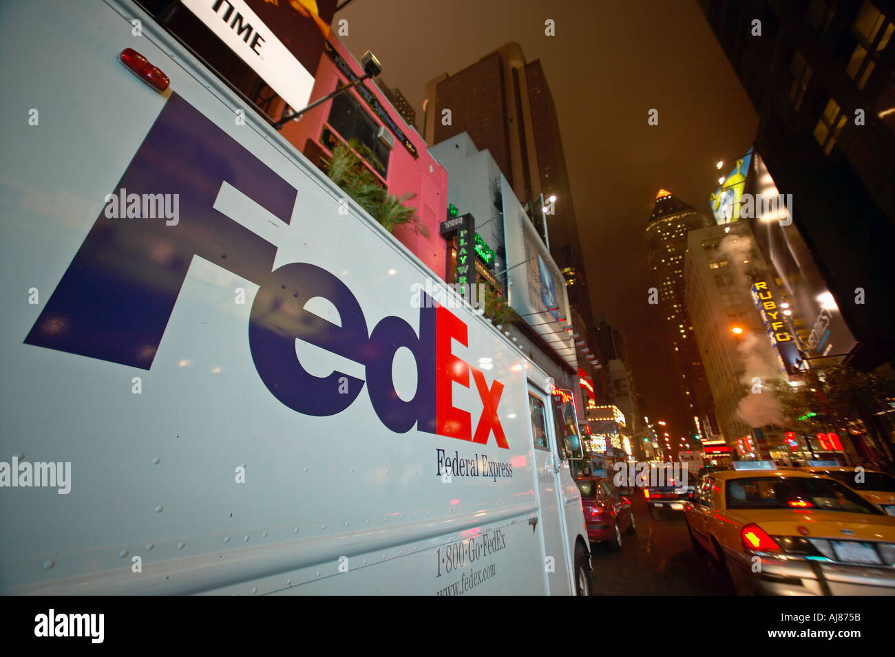 Federal Express truck making deliveries in Times Square at West 49th Street and Broadway New York NY Stock Photo