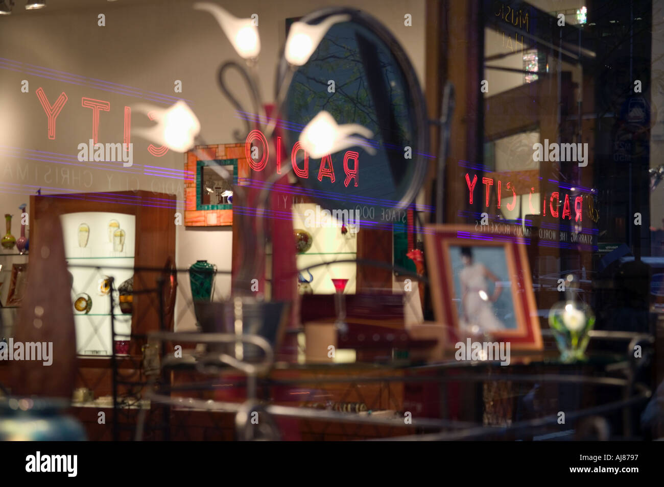 Reflections of Radio City Music Hall signs in window of An American  Craftsman store on 50th Street near Times Square New York NY Stock Photo -  Alamy