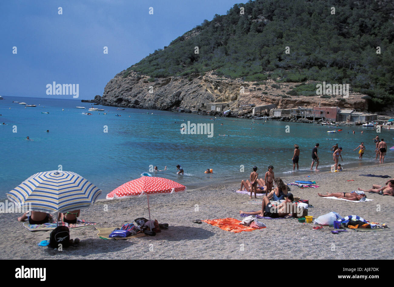 People Relaxing At Beach Cala Benirras San Miguel Ibiza