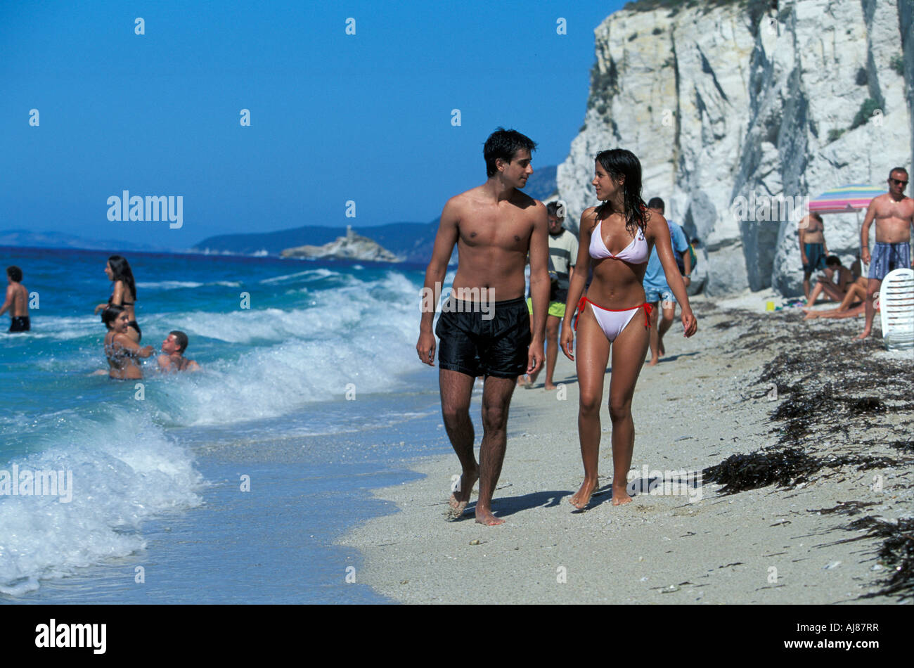 Couple walking along Spiaggia di Capo Blanco Portoferreio Elba Tuscany Italy Stock Photo Alamy