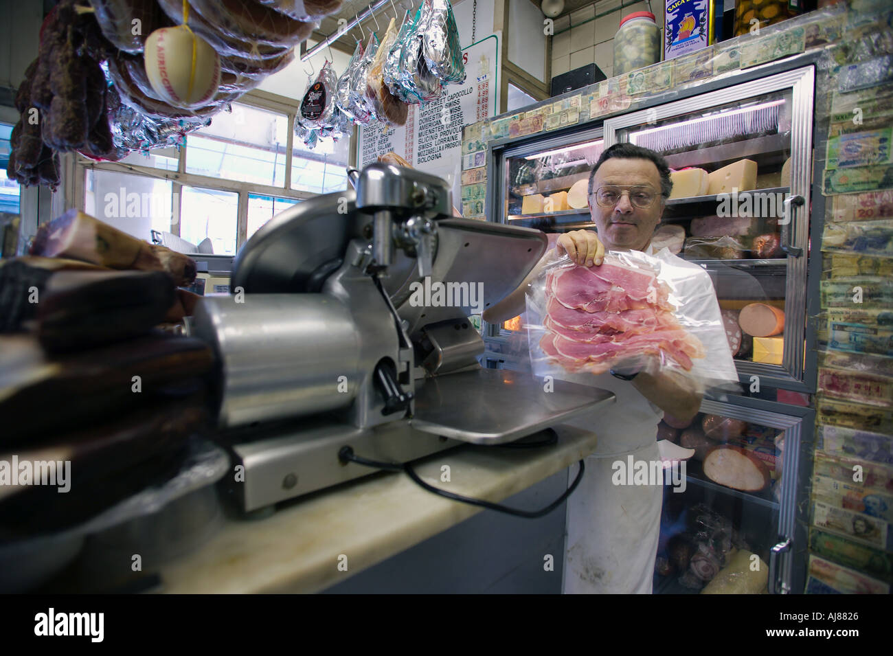 Fresh prosciutto slices at Alleva Dairy on corner of Grand and Mulberry Streets is the Oldest Italian Cheese Store in America Stock Photo