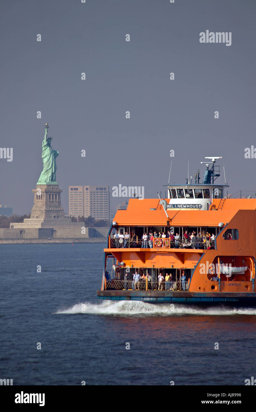 Staten Island ferry on the Hudson River with Statue of Liberty and Hoboken New Jersey skyline in background New York NY Stock Photo