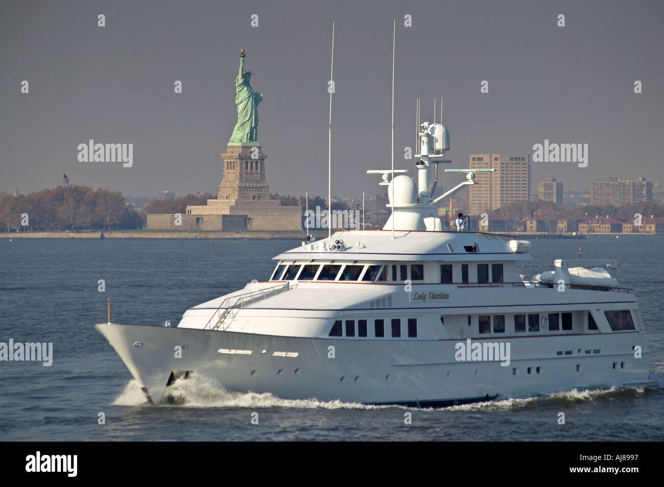 Lady Sheridan yacht passes Statue of Liberty on Hudson River New York NY Stock Photo