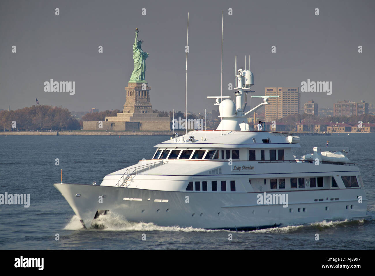 Lady Sheridan yacht passes Statue of Liberty on Hudson River New York