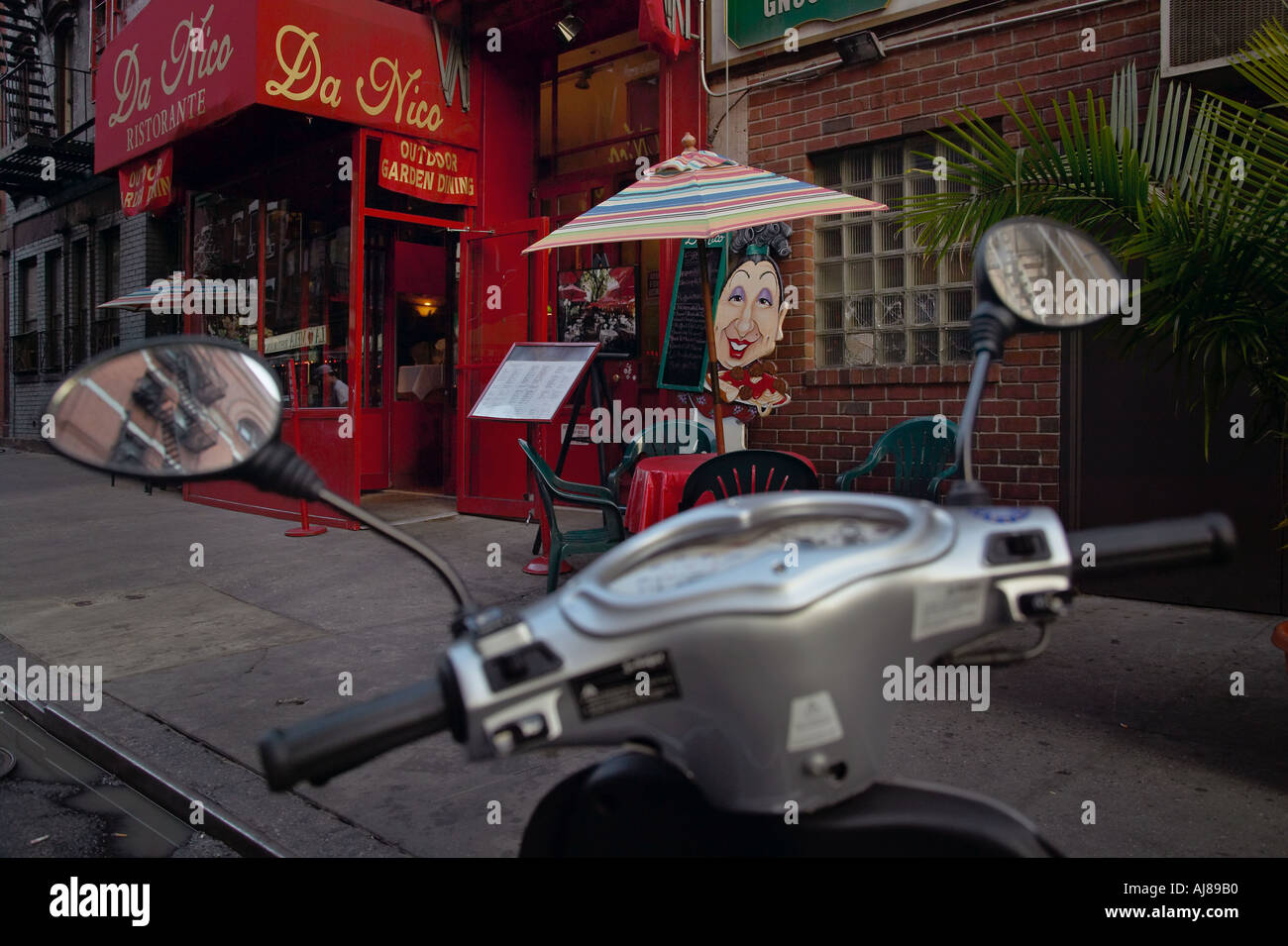 Italijet motor scooter parked in front of Da Nico Ristorante Mulberry Street in Little Italy New York NY Stock Photo