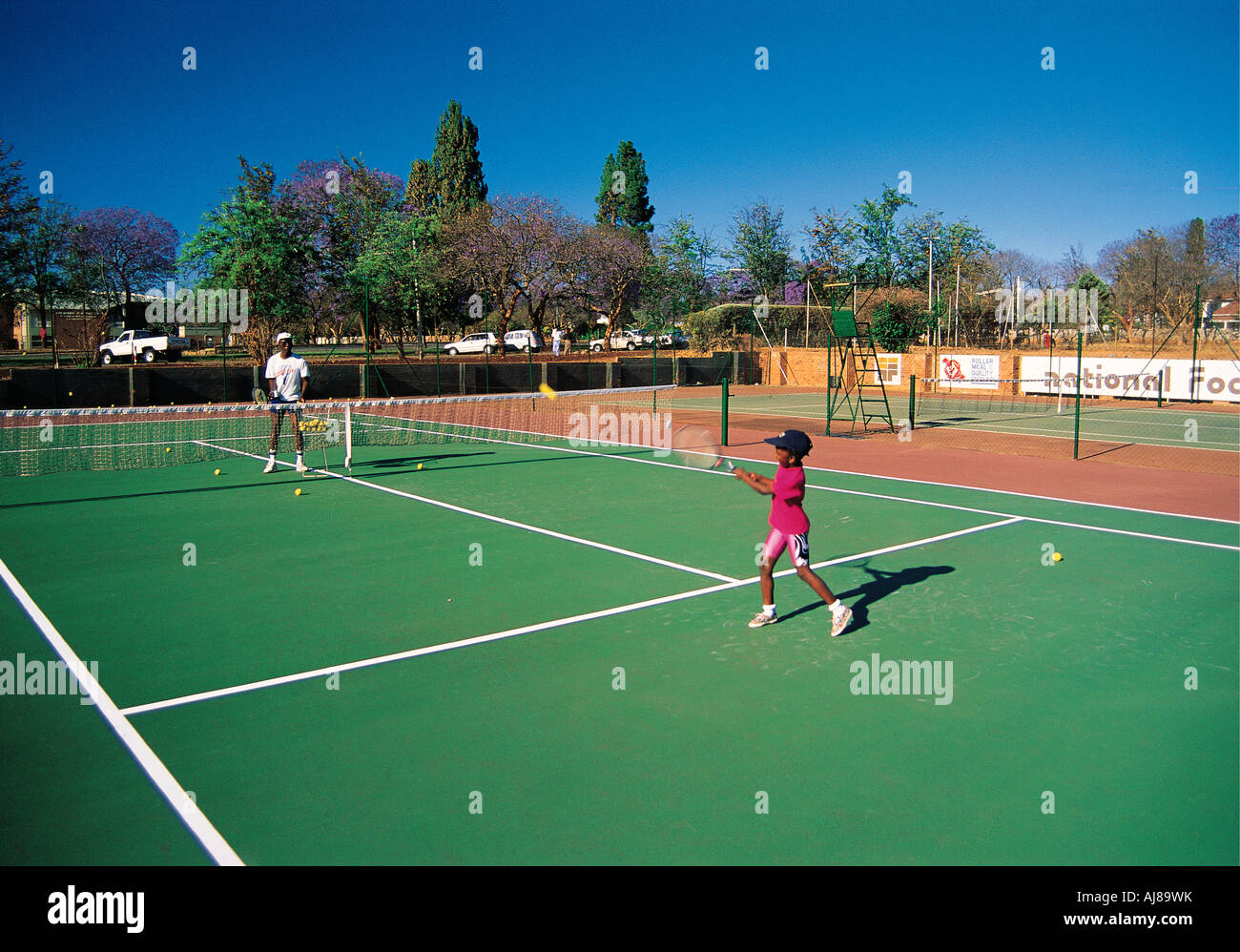 Two 2 black Africans playing tennis Bulawayo Zimbabwe Stock Photo - Alamy