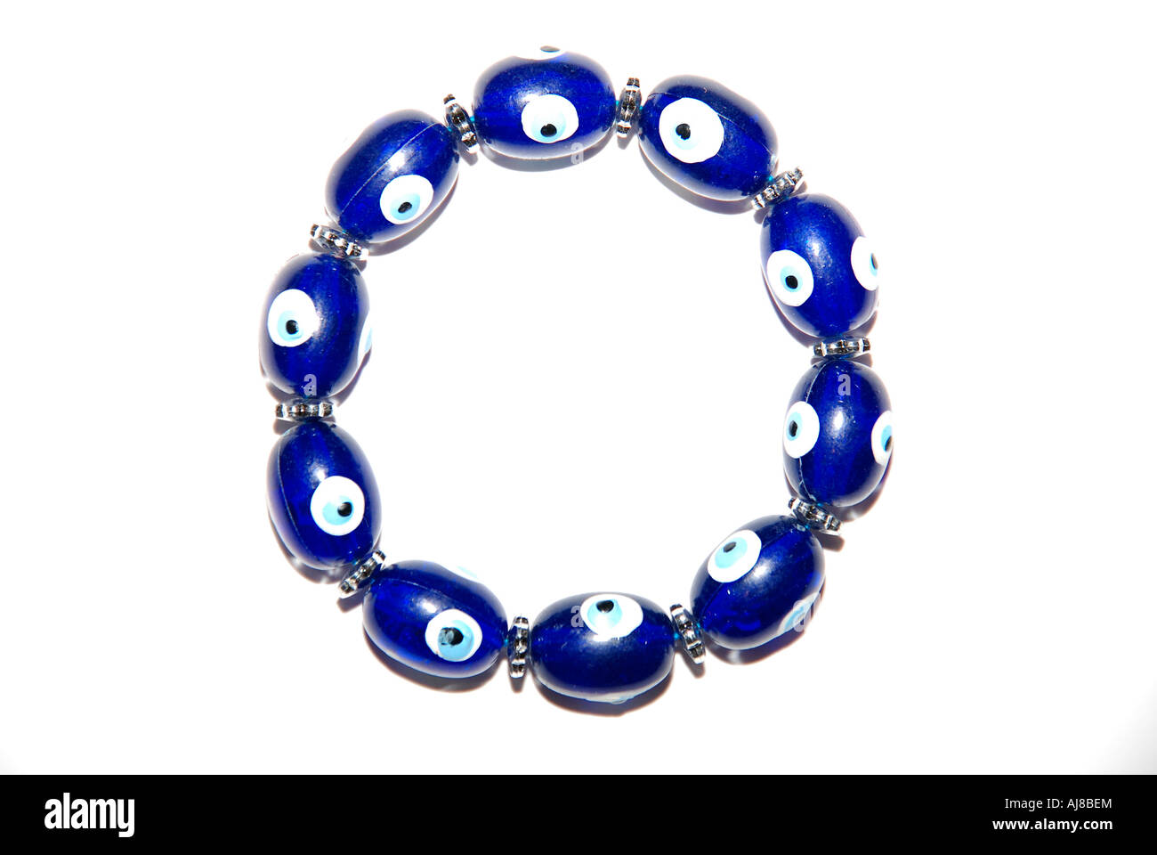 A bracelet with magic eyes used to ward off the evil eye and spirits on white background Photo - Alamy