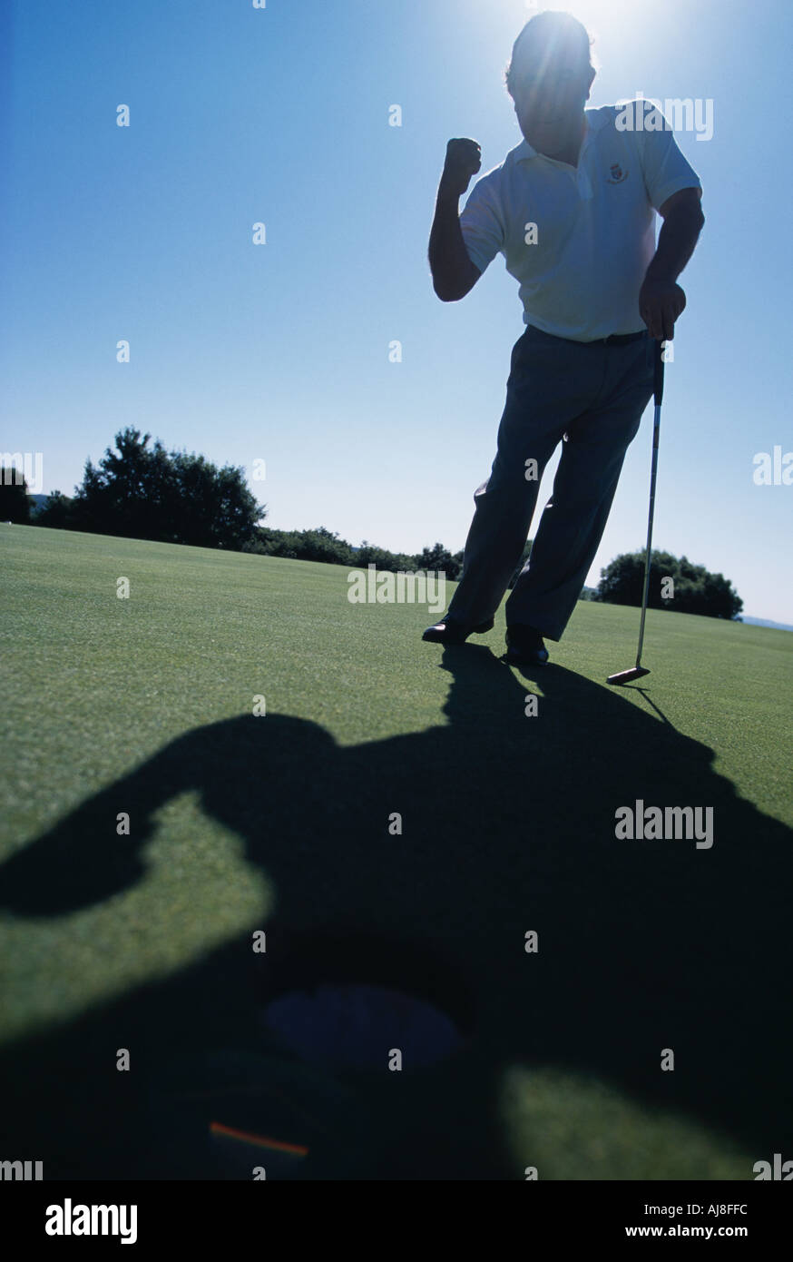 Golf putting celebration Stock Photo