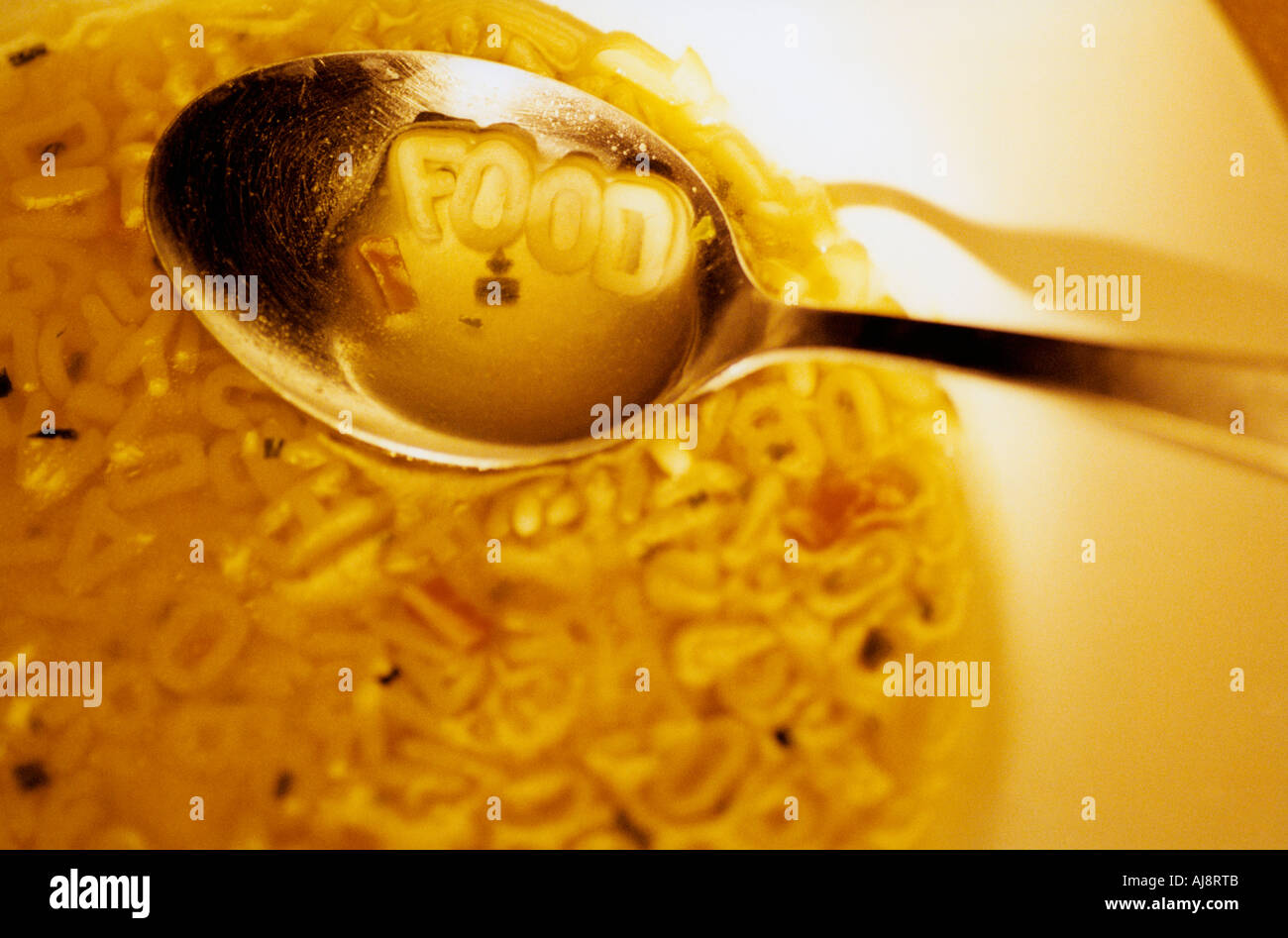 Alphabet noodle soup used to spell food Stock Photo Alamy