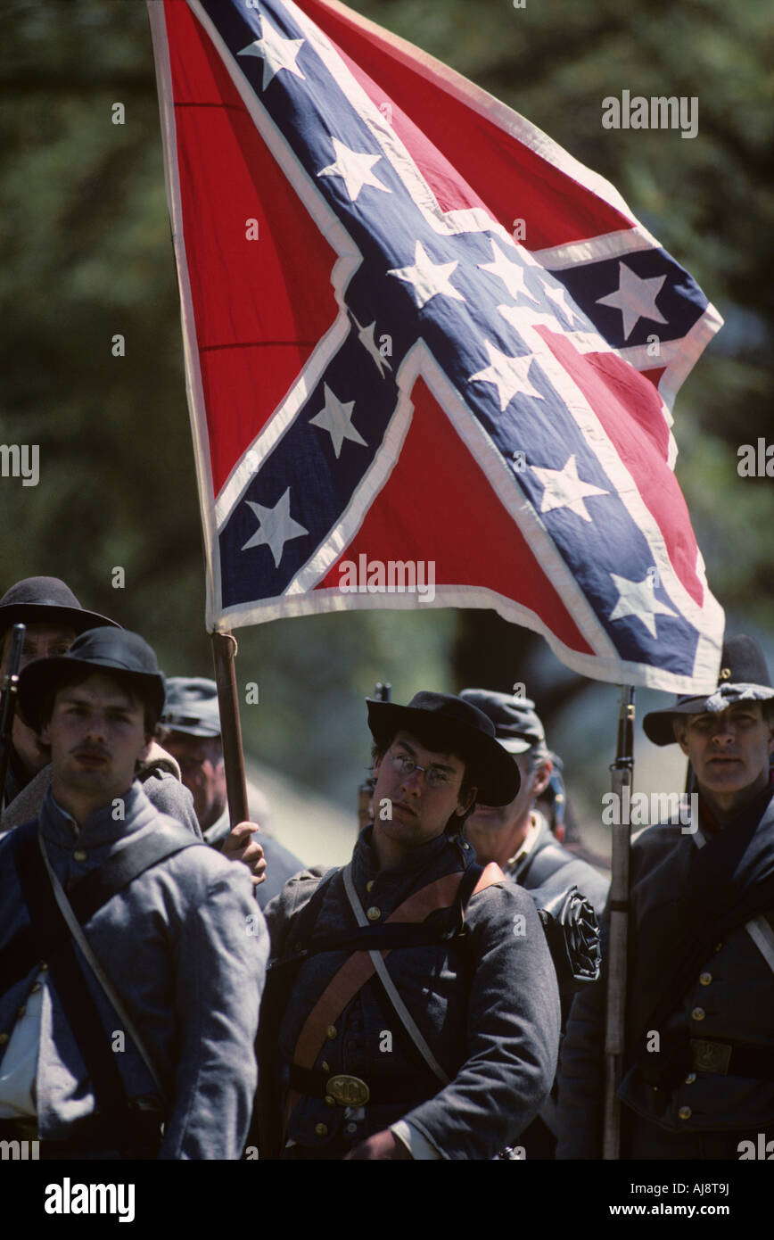USA Virginia Confederate soldier carries battle flag during reenactment of Civil War Battle of Chancellorsville Stock Photo