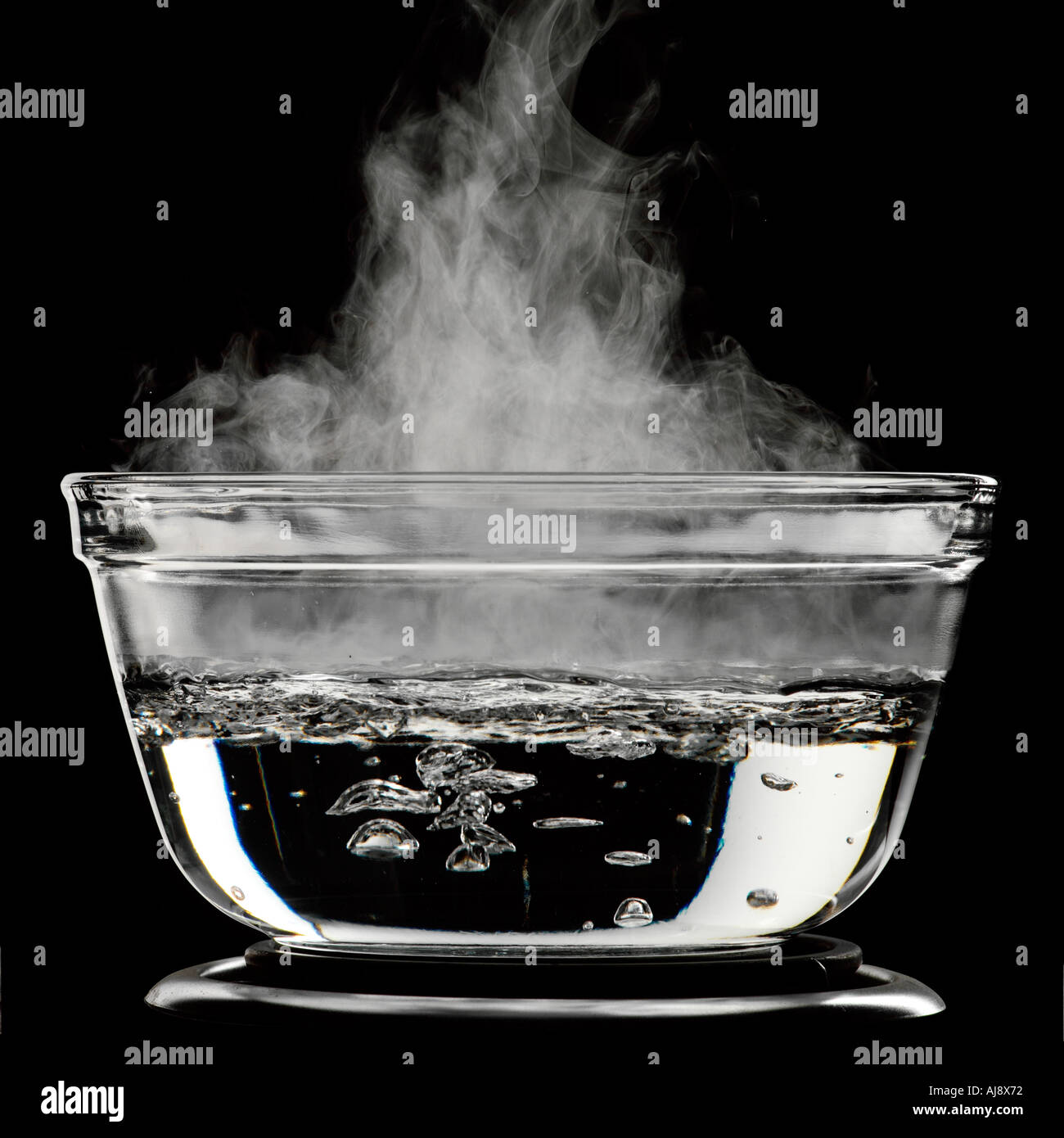 Water boiling in a glass pot Stock Photo