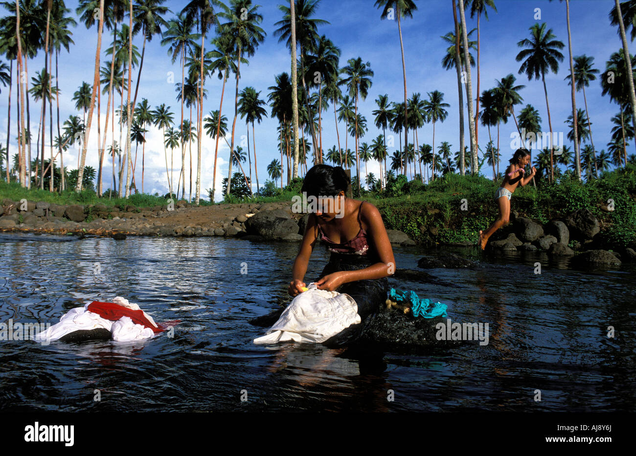 Girl washing clothes in river hires stock photography and images Alamy