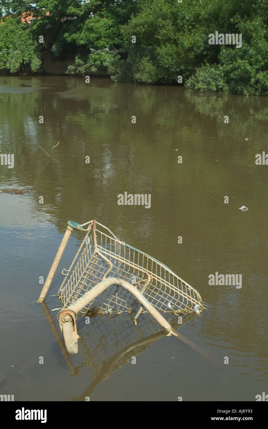 Abandoned shopping trolley in the River Derwent at Malton North Yorkshire Stock Photo
