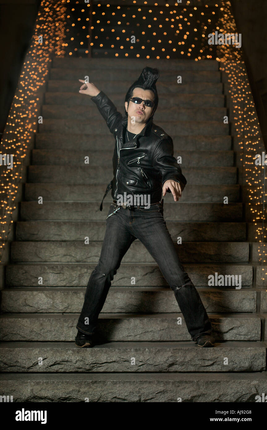 Man posing on steps dressed in rock and roll outfit Tokyo Japan Stock Photo  - Alamy