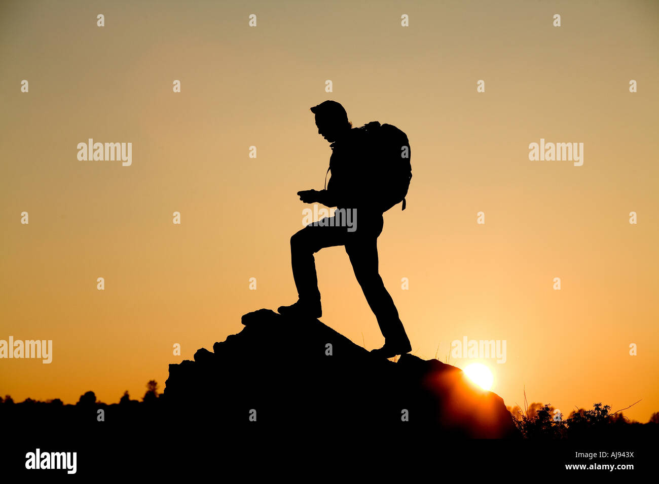 man hikes in California foothills. Stock Photo