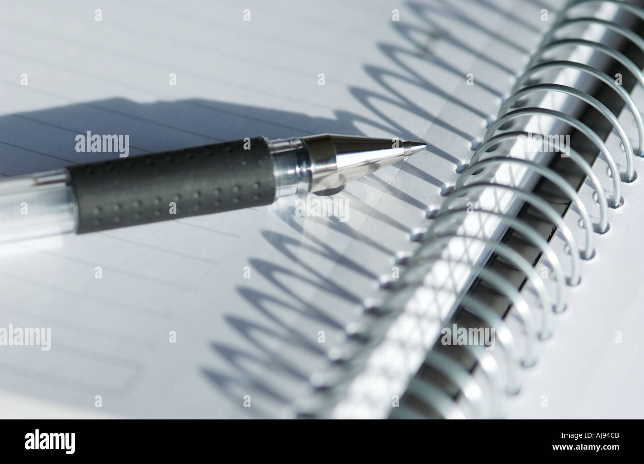 Close up of Spiral note pad and pen Stock Photo