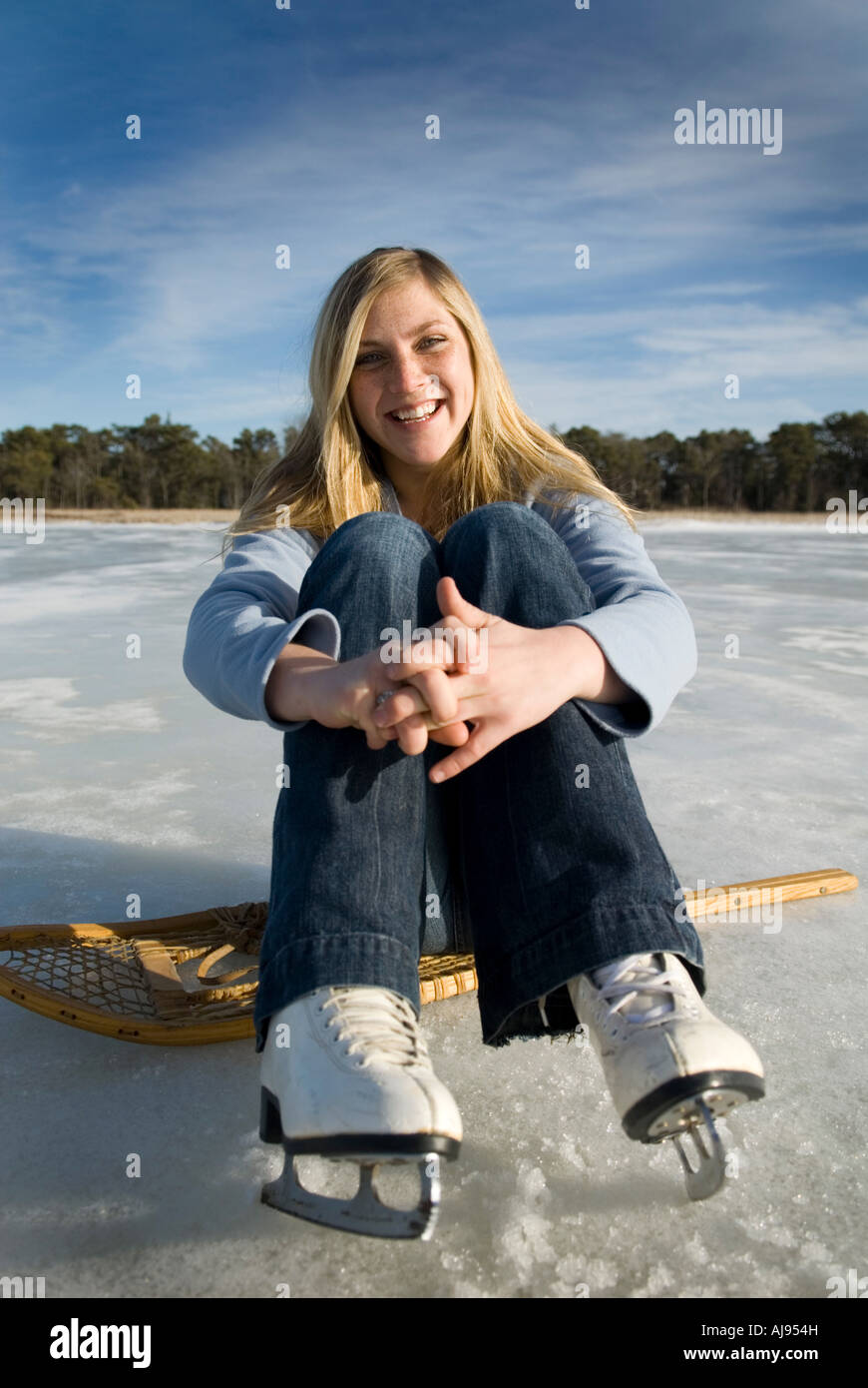 Portrait of a young woman wearing ice skates Stock Photo Alamy