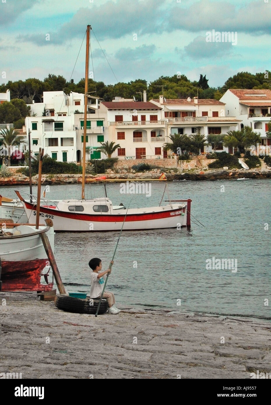Boy relaxing in fishing boat hi-res stock photography and images - Alamy