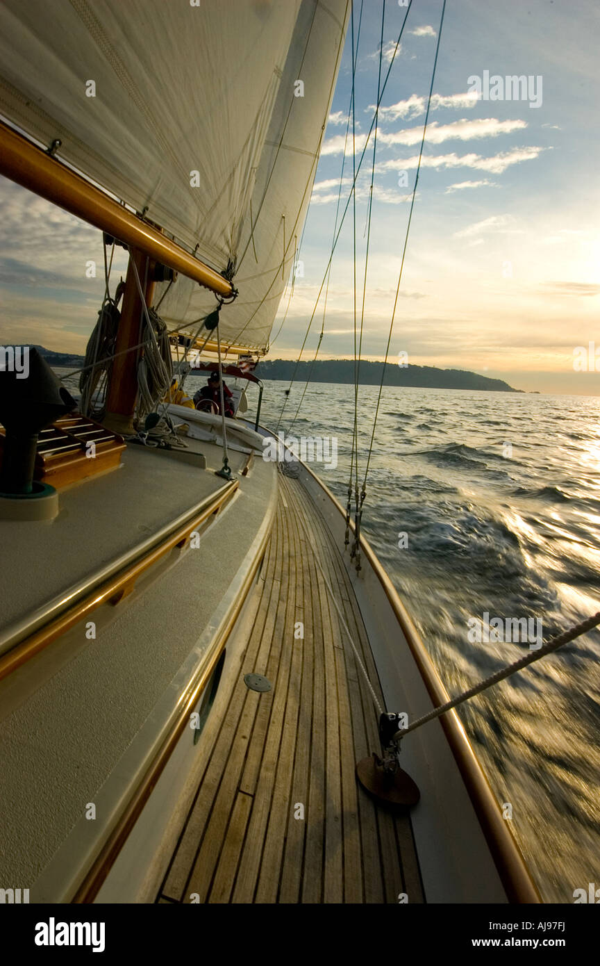 Sunset from the deck of a sailing yacht. Stock Photo