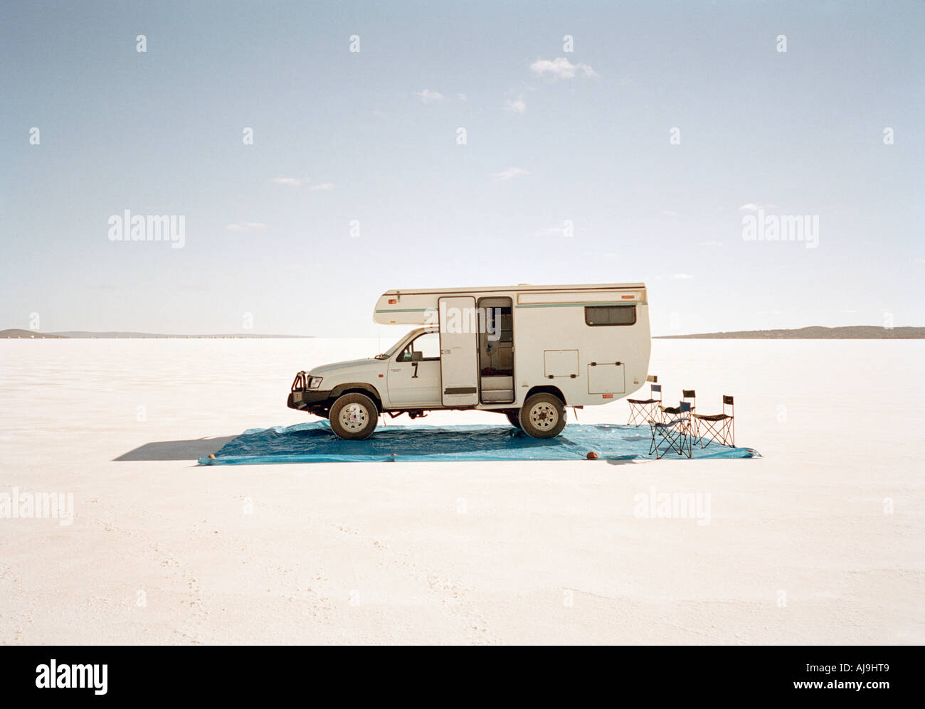 Camping with motor home on salt flat Stock Photo