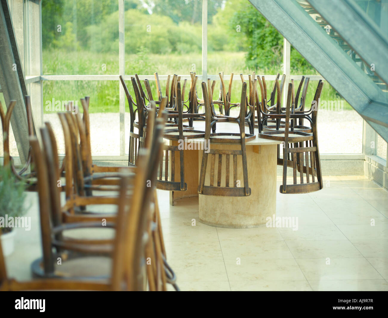 Chairs Upside Down on Tables in Cafe Stock Photo Alamy