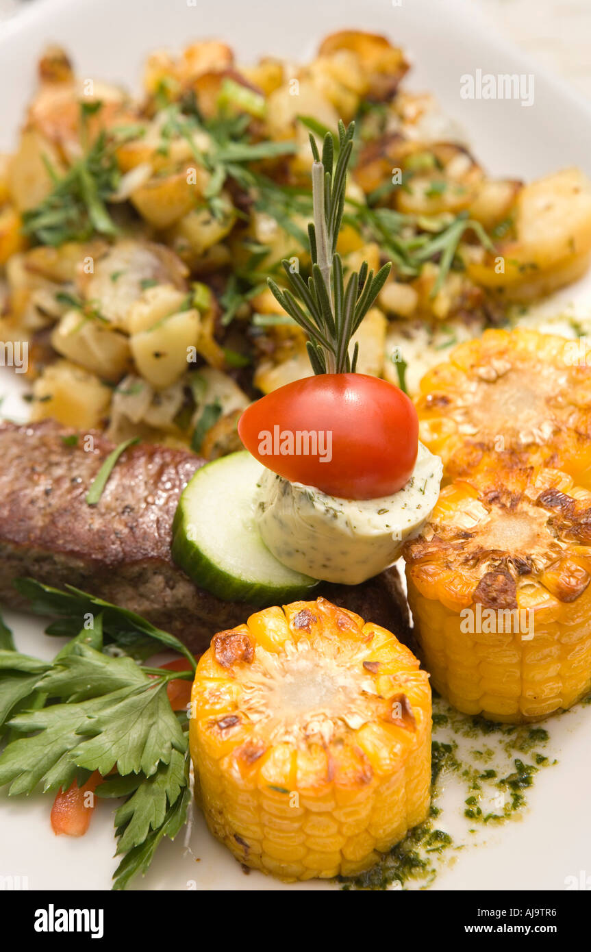 A rump steak and assorted vegetables on a plate Stock Photo