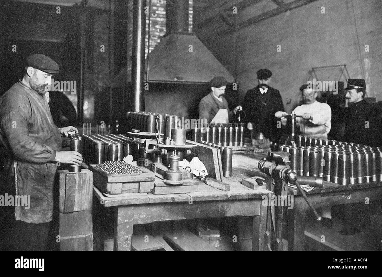 Filling shrapnel shells in a British munitions factory, World War I, 1914-1918. Artist: Unknown Stock Photo