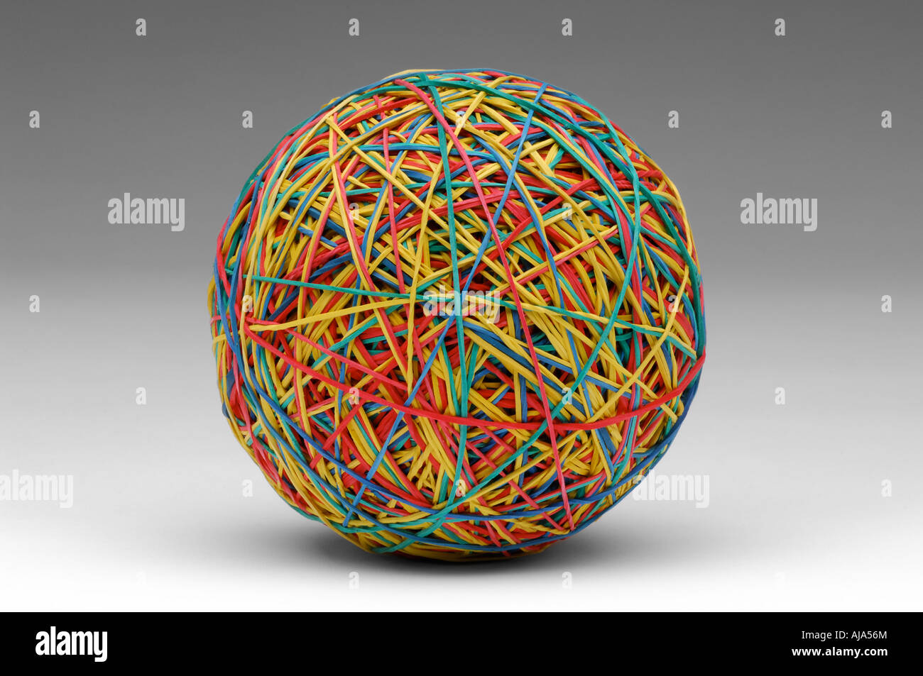 Rubber band ball on grey background Stock Photo