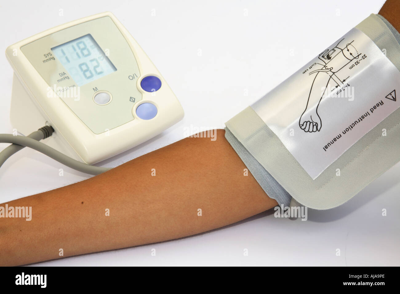 Woman checking blood pressure and heart rate with a digital blood
