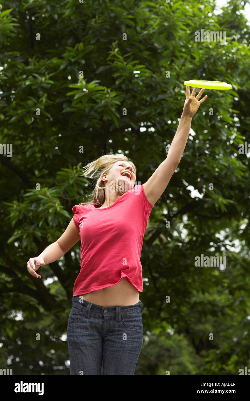 Woman Catching Frisbee Stock Photo - Alamy