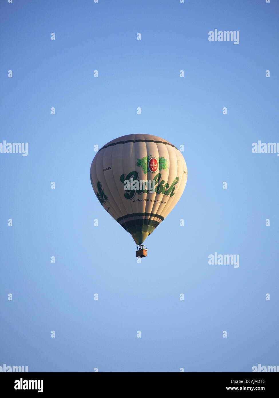 Grolsch sponsored hot air balloon in blue sky Breda hot air ballooning festival 2006 the Netherlands Stock Photo