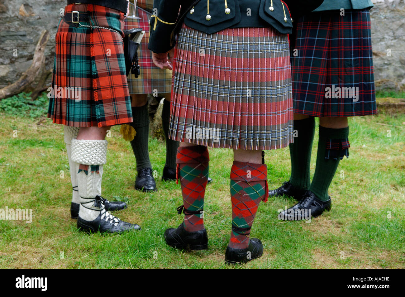 Group of men wearing traditional kilts, West Highlands, Trossachs, Scotland, UK Stock Photo