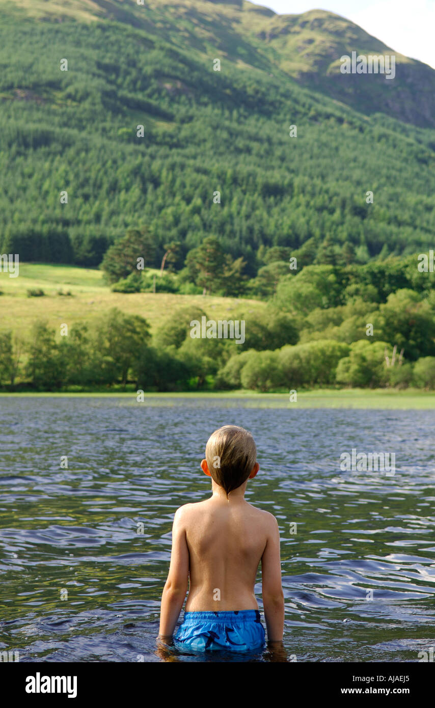 Boy swimming in Loch Doine, West Highlands, Scotland, UK Stock Photo