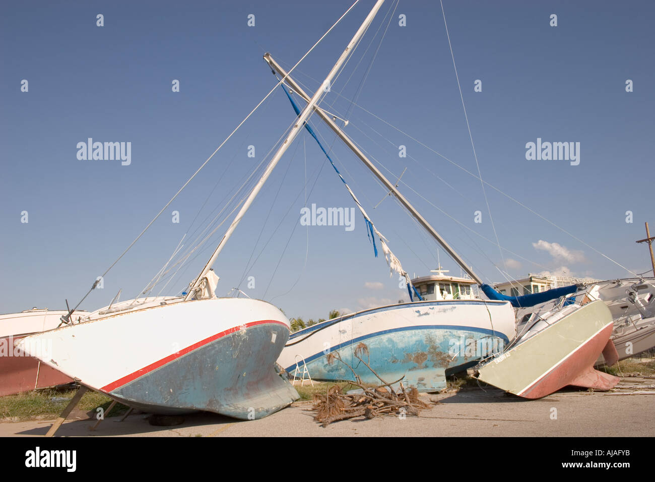 Three destroyed sailboats left on the shore after hurricane Katrina.  New Orleans, LA. USA. Stock Photo