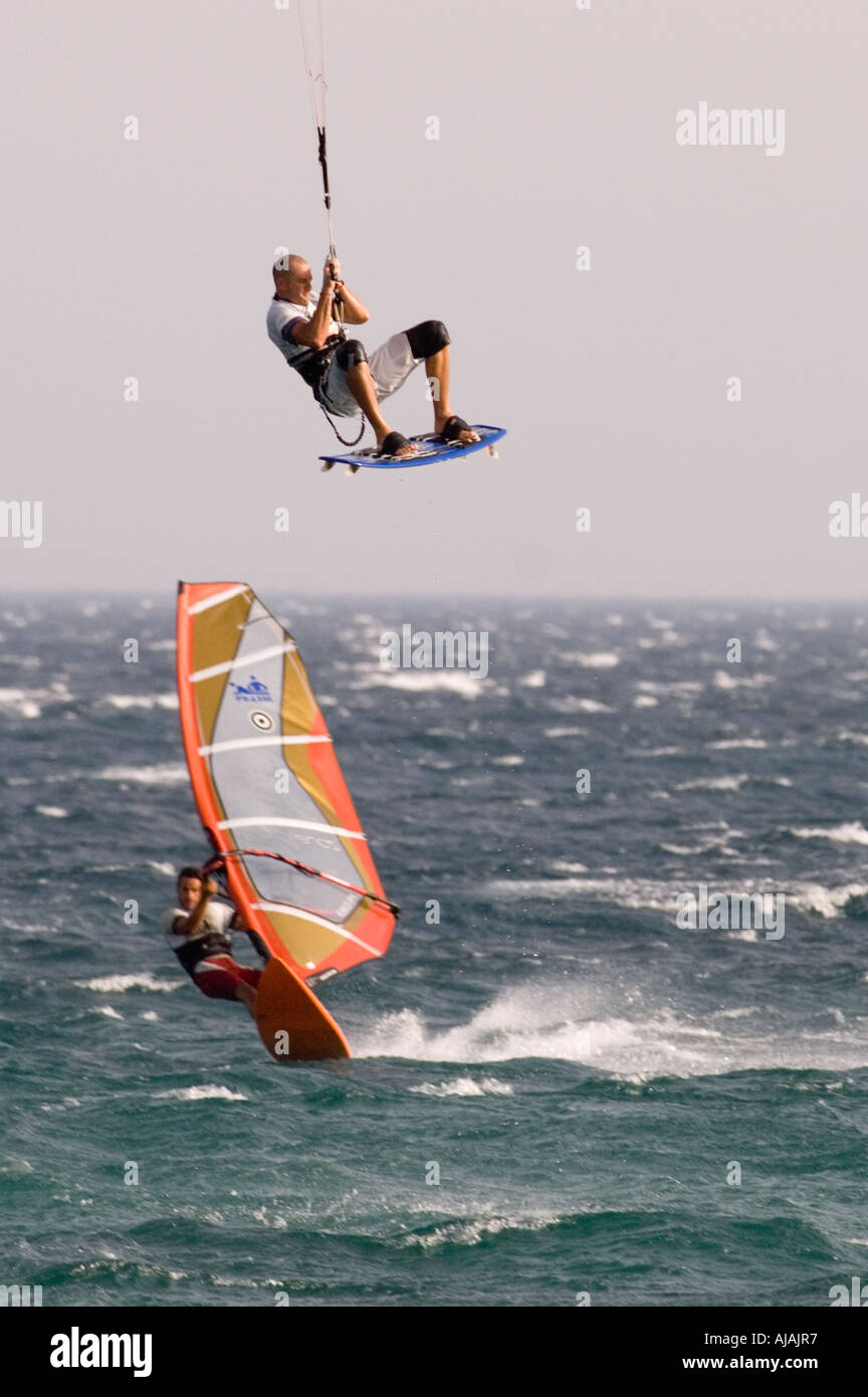 kitesurfing vs windsurfing Stock Photo - Alamy