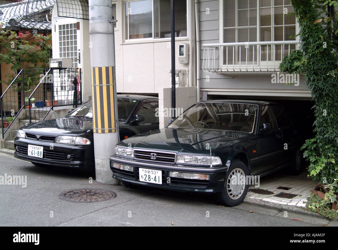 Cars In Low Garages Under Houses Kyoto Japan Stock Photo 4791342