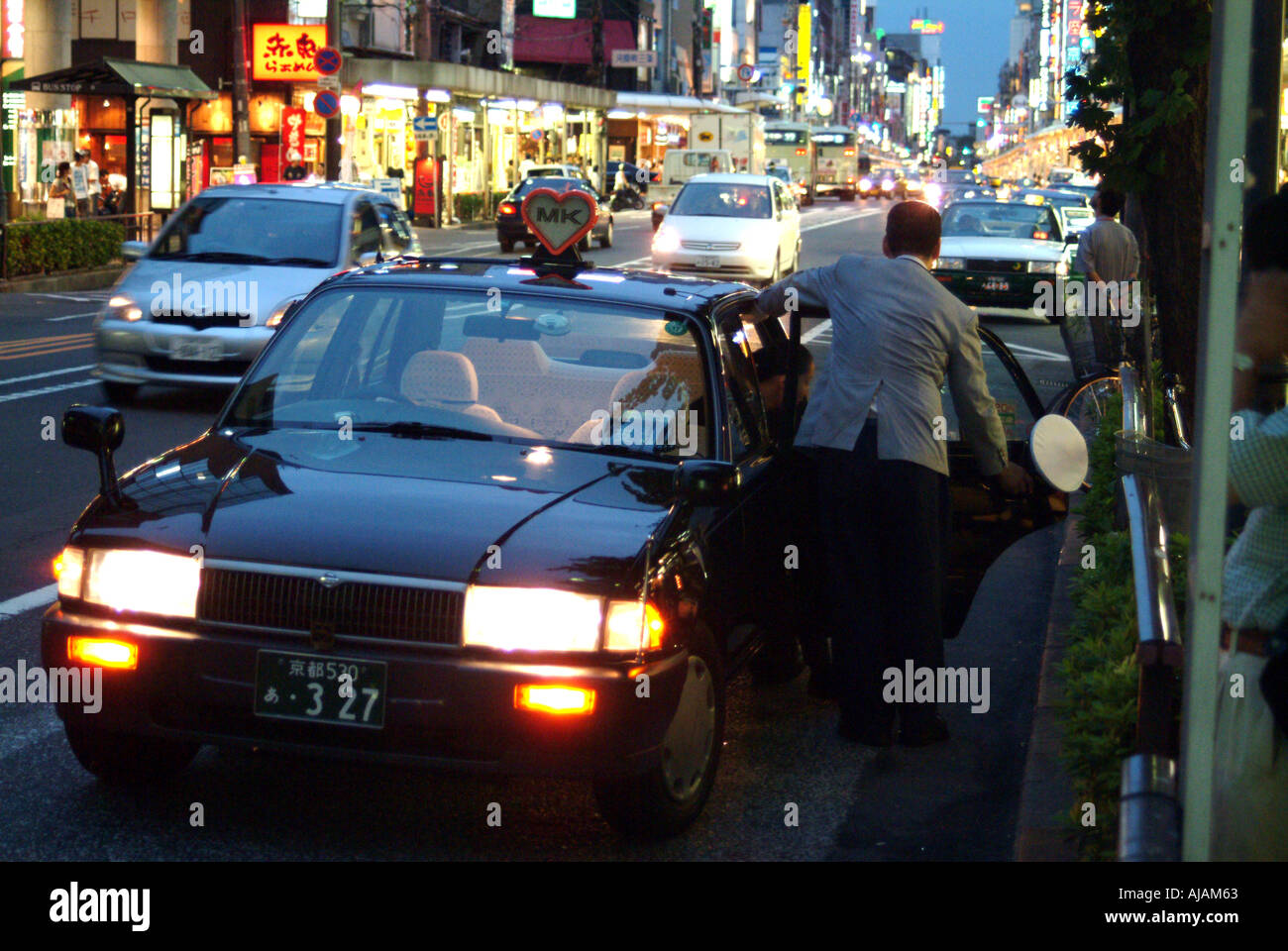 Kawaramachi street traffic and taxi at dusk Kyoto Japan Stock Photo