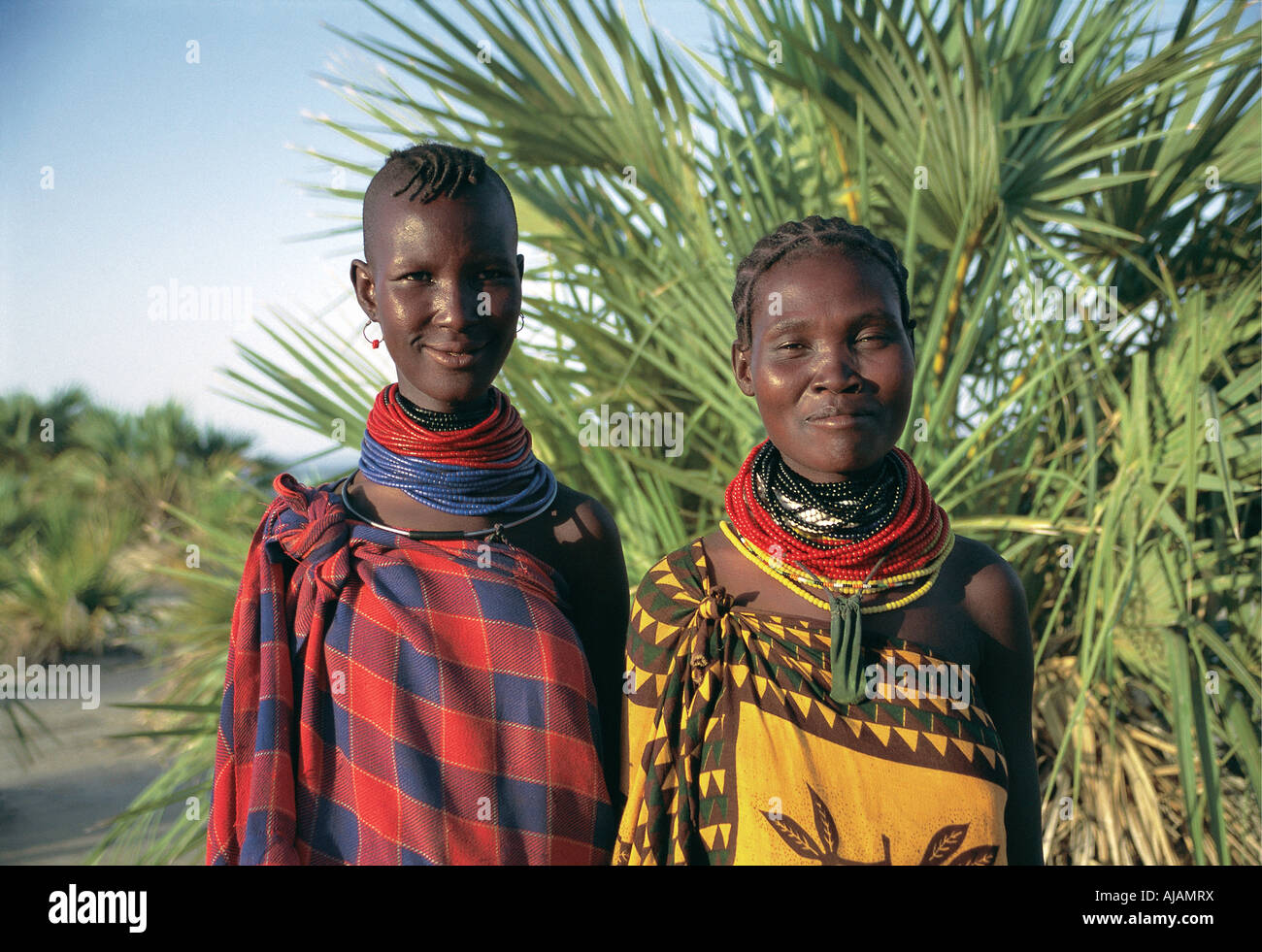 Portrait of two 2 traditional Turkana women Northern Kenya East Africa They are both smiling with friednly expressions Stock Photo