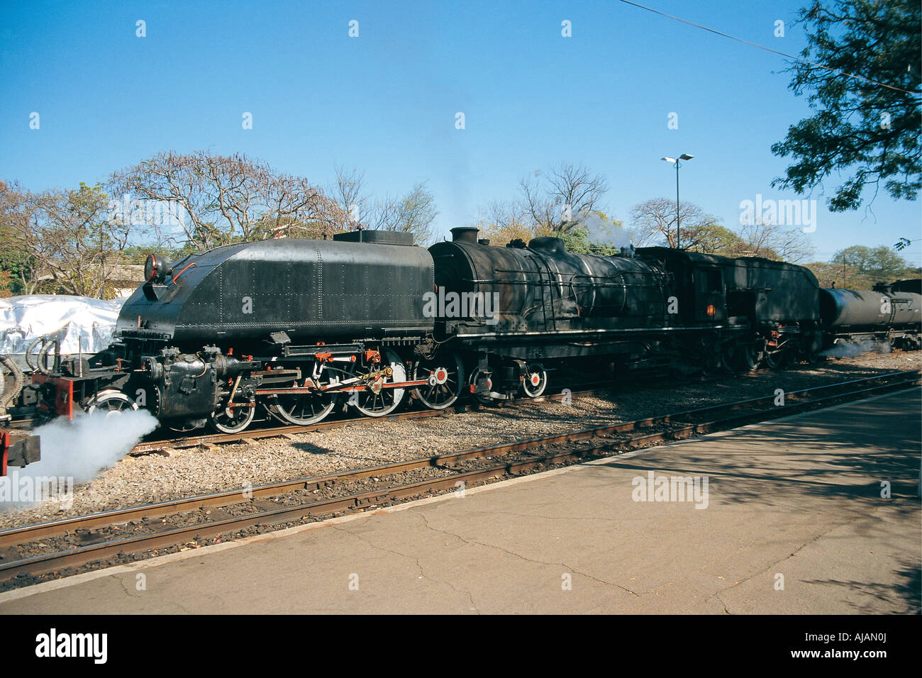 4 6 4 Four six four steam driven railway engine Beyer Garratt and tender at Victoria Falls Station Zimbabwe Stock Photo