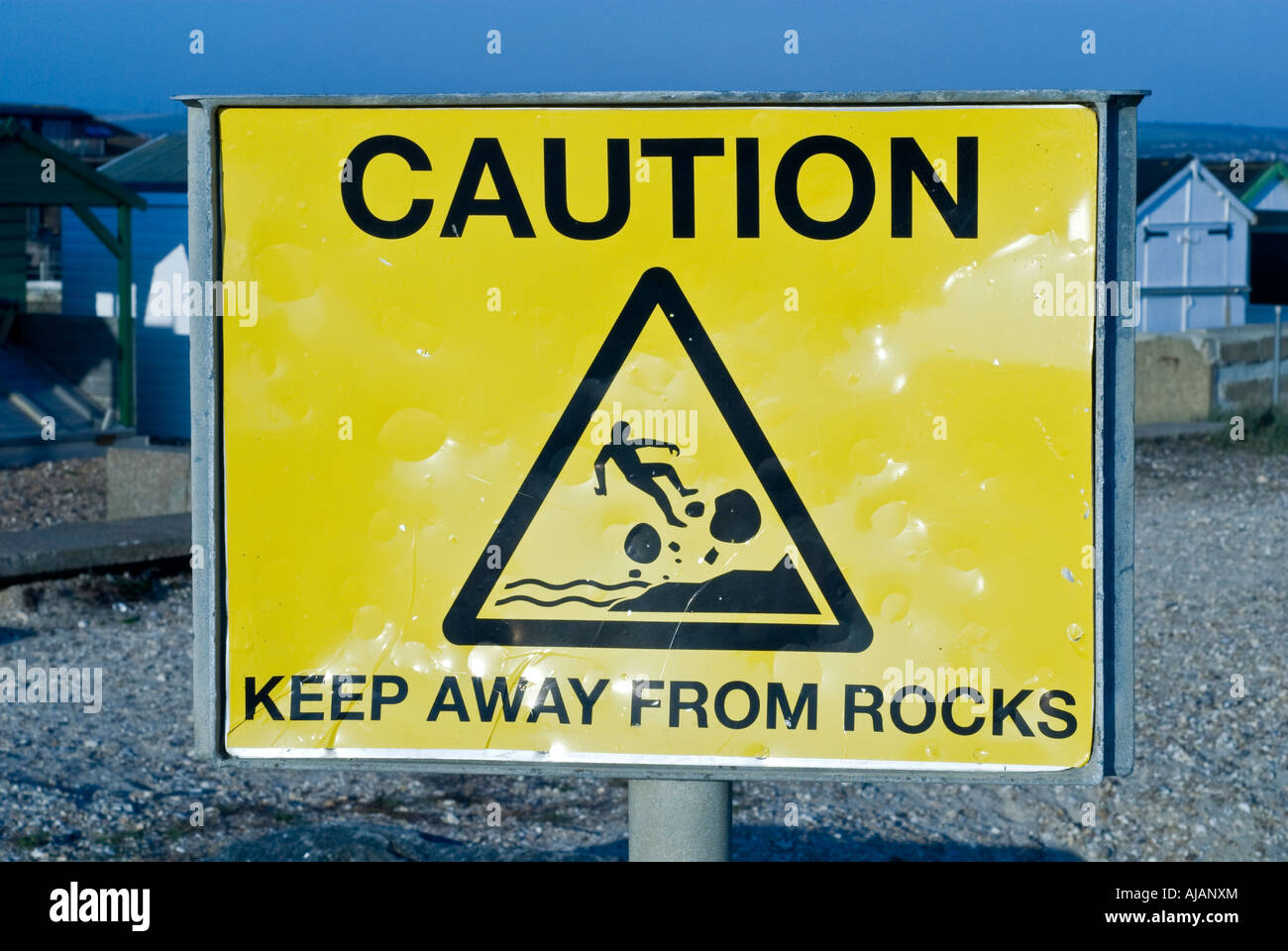 Public information sign caution rocks Stock Photo - Alamy