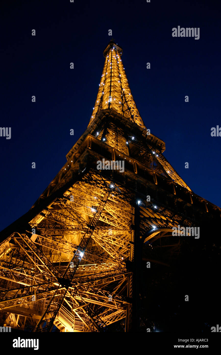 Eiffel Tower at night, blue sky Stock Photo