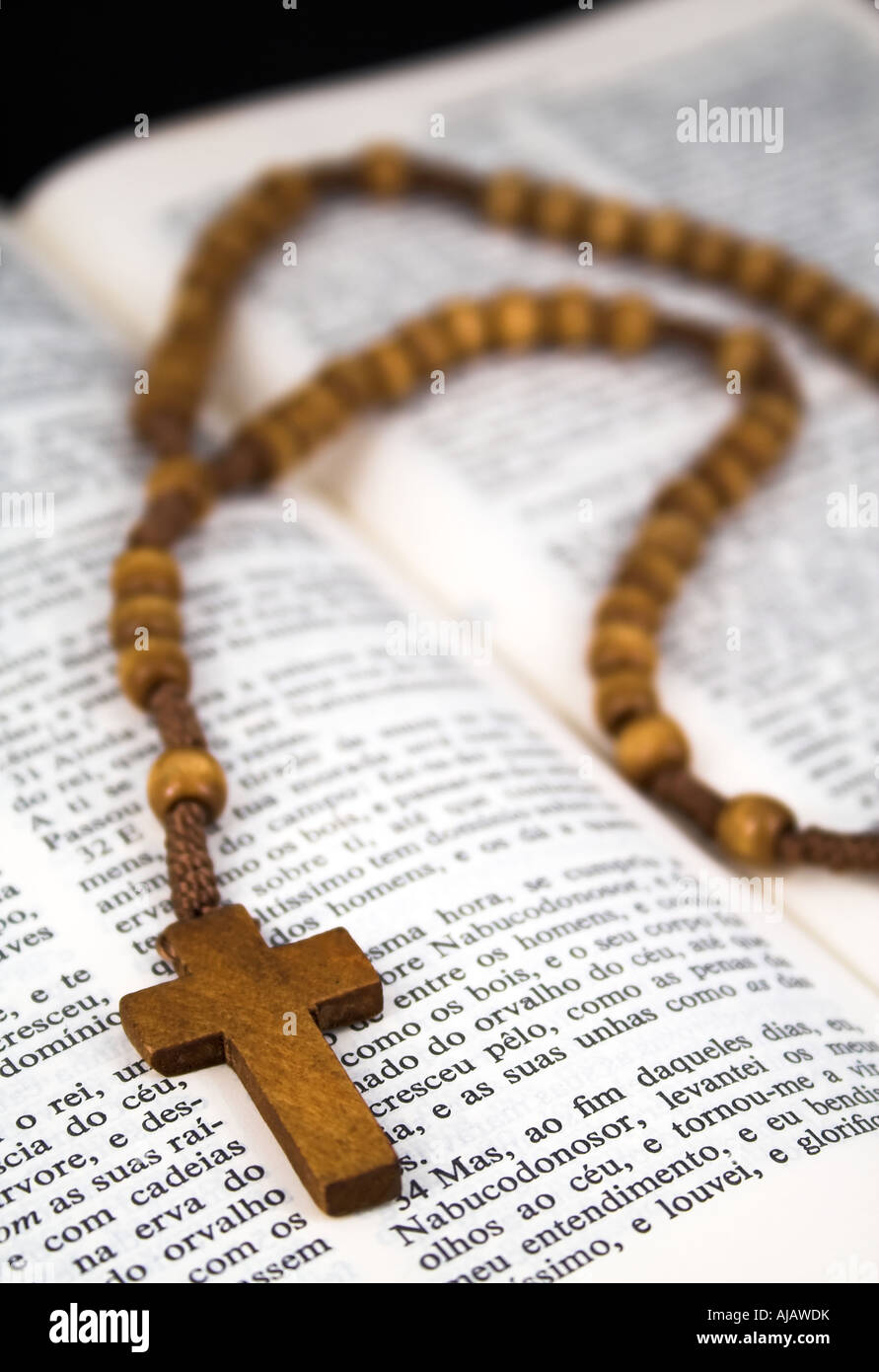 Open Bible with rosary Stock Photo - Alamy