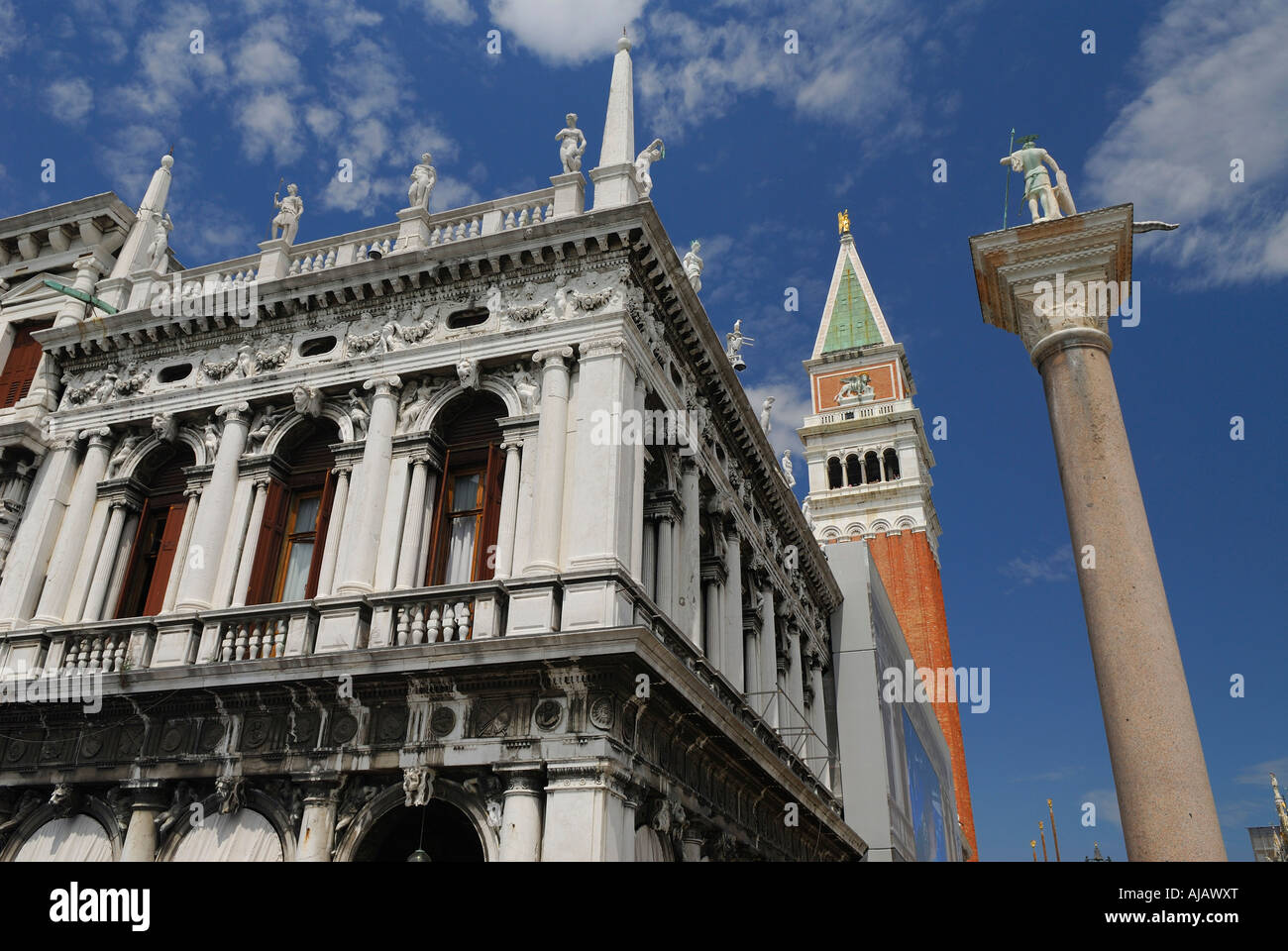 Saint Theodore on a pillar and Marciana library with Campanile bell tower in St Marks San Marco piazzetta Venice Italy Stock Photo