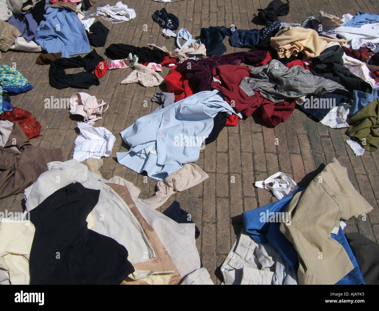 pile of old clothes left on street Stock Photo Alamy