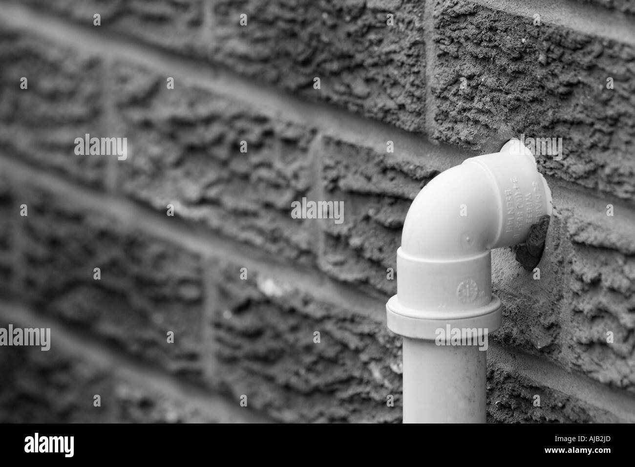 Drain pipe in brick wall at a home Stock Photo Alamy