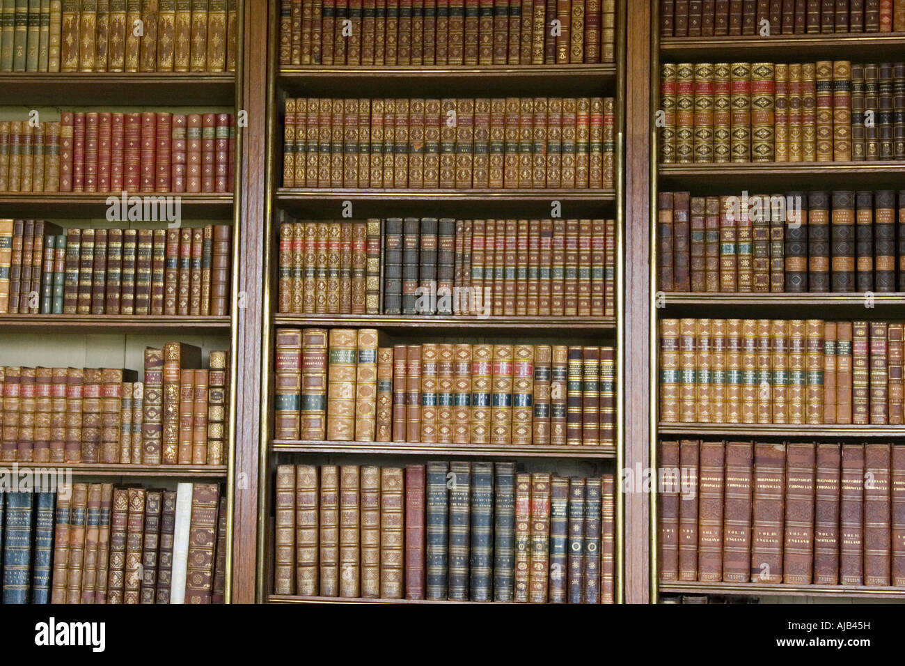 Old leather bound volumes of books in library bookcases Stock Photo Alamy